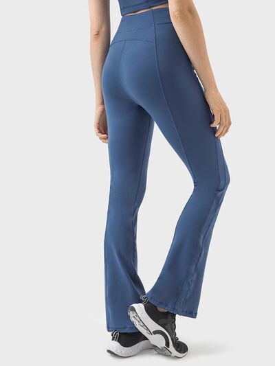 Pantalones deportivos de cintura alta con detalle de cremallera