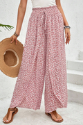 Pantalones negros de pierna ancha con estampado floral, fruncido y abertura lateral