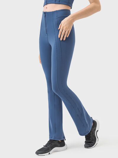 Pantalones deportivos de cintura alta con detalle de cremallera