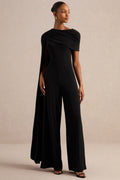 Emelisse | Mono negro de punto con cuello redondo, detalle drapeado y mangas tipo capa