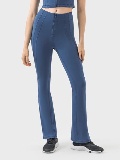 Pantalones deportivos de cintura alta con detalle de cremallera