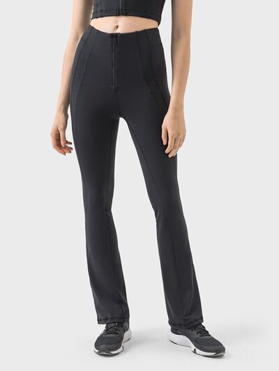 Pantalones deportivos de cintura alta con detalle de cremallera