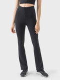 Pantalones deportivos de cintura alta con detalle de cremallera