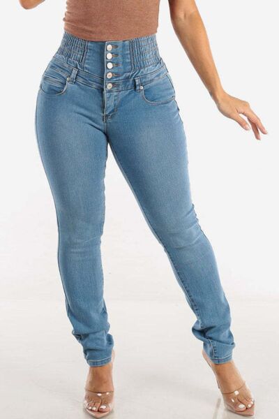 Jeans ajustados de cintura alta con botones y efecto realce de glúteos