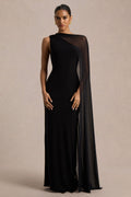Mirelle | Vestido largo negro de punto con cuello barco, capa de malla y abertura trasera